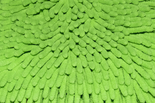 Close up of textured light green microfiber rug
