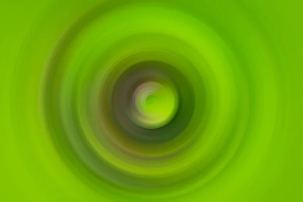 Яскраво-зелене радіальне розмиття з фіолетовими тонами біля центру — стокове фото