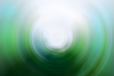 Dramatik koyu yeşil ve turkuaz dairesel bulanıklık. Ortasında gölge ve parlama var.