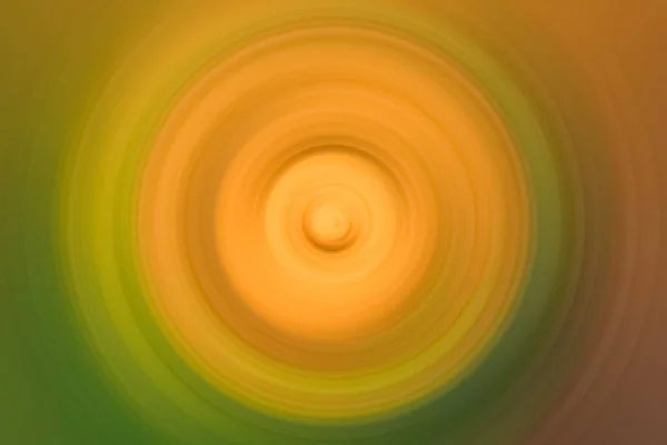 Levendig oranje cirkelvormige vervaging met groene rand — Stockfoto