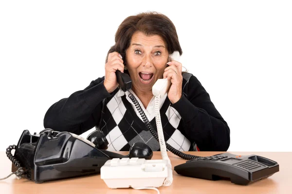 Senior mulher com telefones — Fotografia de Stock