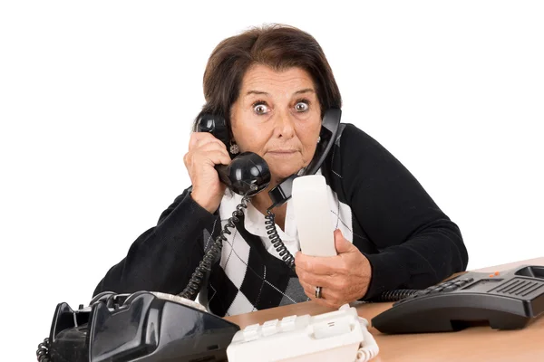 Senior mulher com telefones — Fotografia de Stock