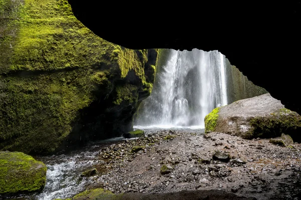 Waterfall and cave in Iceland — Stock Photo, Image