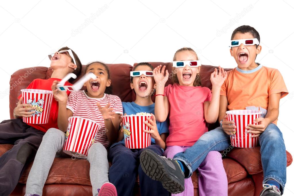 children watching movie with popcorn