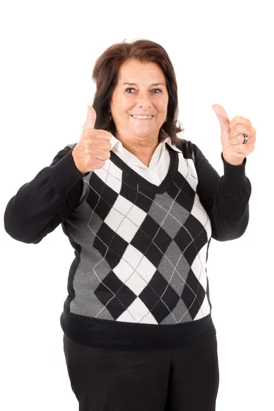 Старшая женщина показывает большие пальцы вверх — стоковое фото