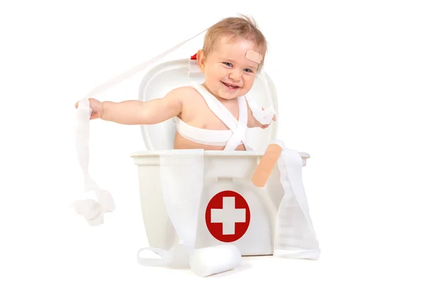 Baby boy with fist aid kit — Stock Photo, Image