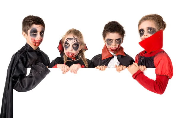 Kinderen in Halloween kostuums — Stockfoto