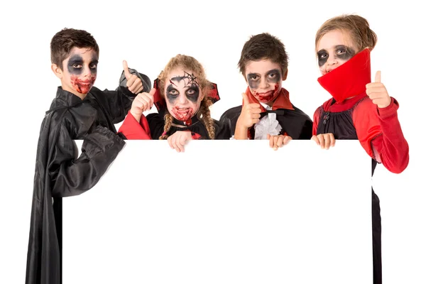 Kinderen in Halloween kostuums — Stockfoto