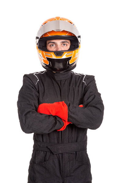 Racing driver posing with helmet isolated in white