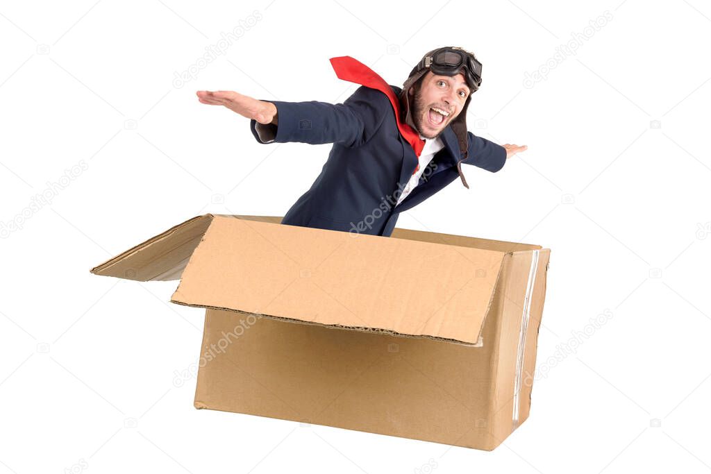 Businessman flying a carboard box isolated in white