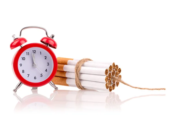 Bomb of alarm clock and cigarettes — Stock Photo, Image