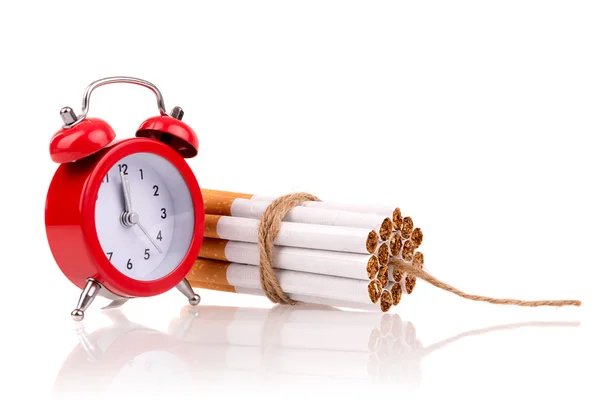 Bomb of alarm clock and cigarettes — Stock Photo, Image