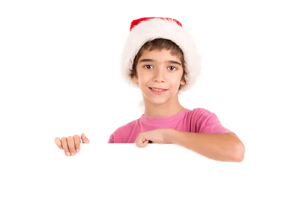 Мальчик в шляпе Санты с доской — стоковое фото