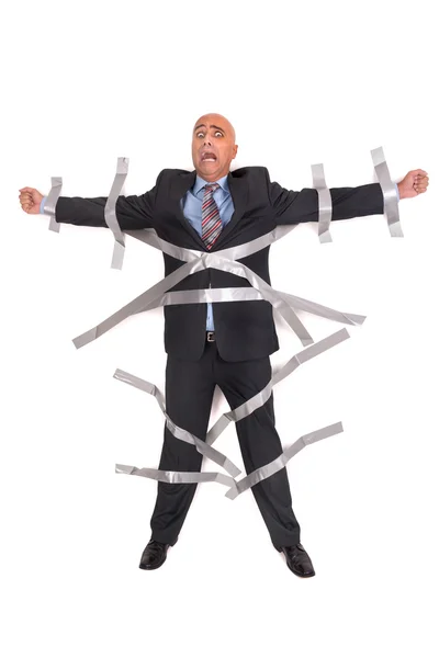 Businessman glued to the wall — Stock Photo, Image