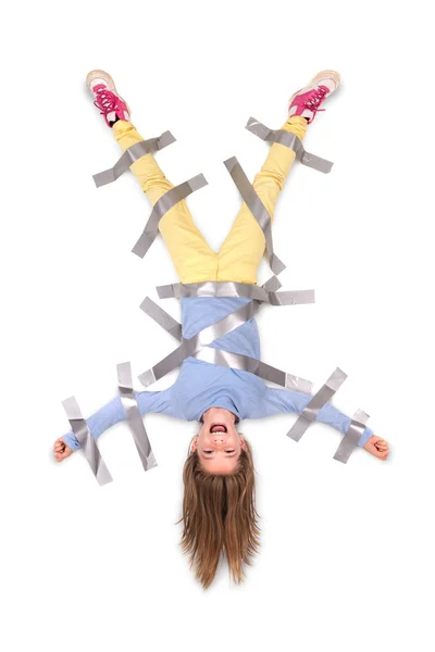 Girl tied to wall with tape — Stock Photo, Image