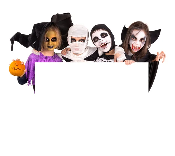 Kinderen in Halloween kostuums — Stockfoto