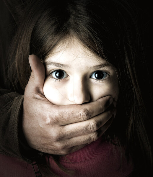 Girl with  man's hand on mouth