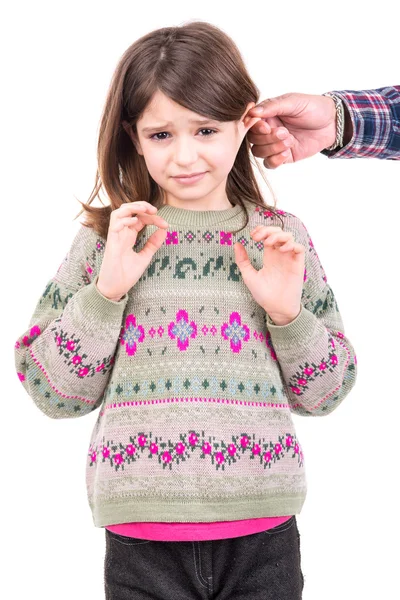 Girl being punished with ear pulling. — Stock Photo, Image