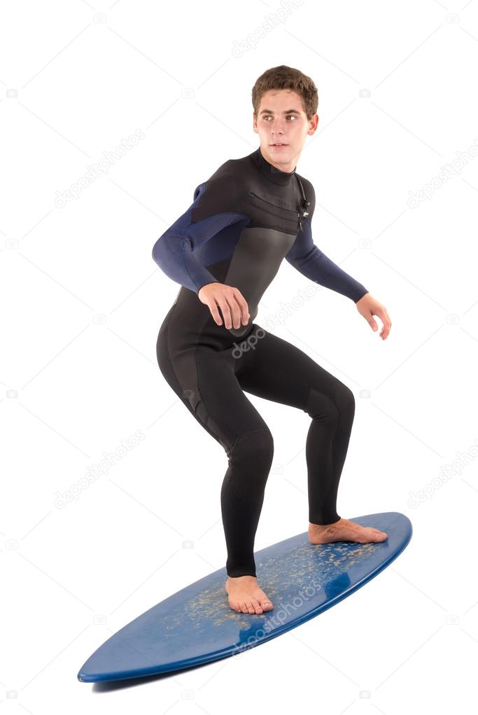 Teenager with surfboard on white