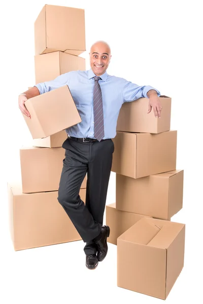 Businessman with cardboard boxes — Stock Photo, Image