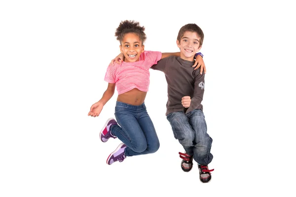 Dos niños saltando en blanco —  Fotos de Stock
