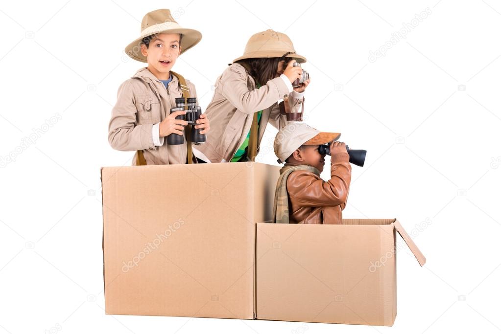 Boys and girl in box on white