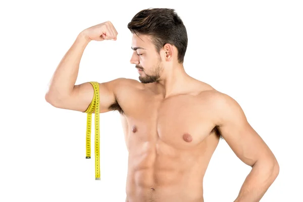 Hombre guapo y en forma con cinta métrica — Foto de Stock