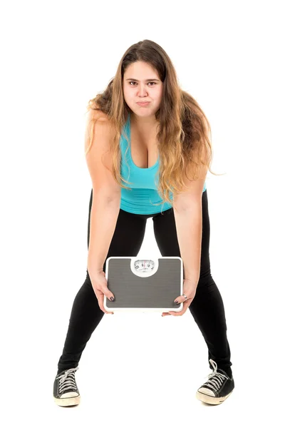 Large girl holding a weight scale — Stock Photo, Image