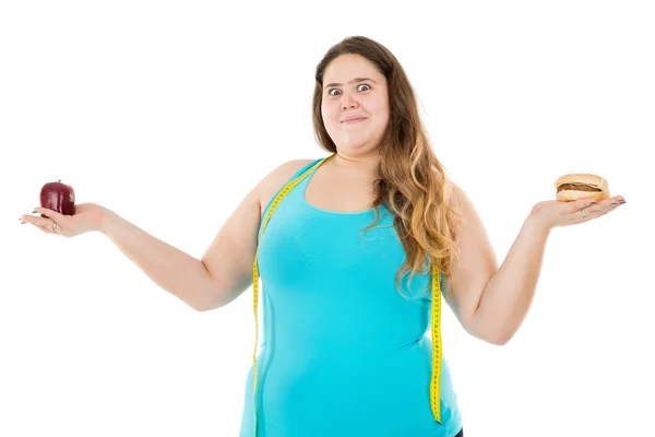 Large girl - hamburger and apple — Stock Photo, Image