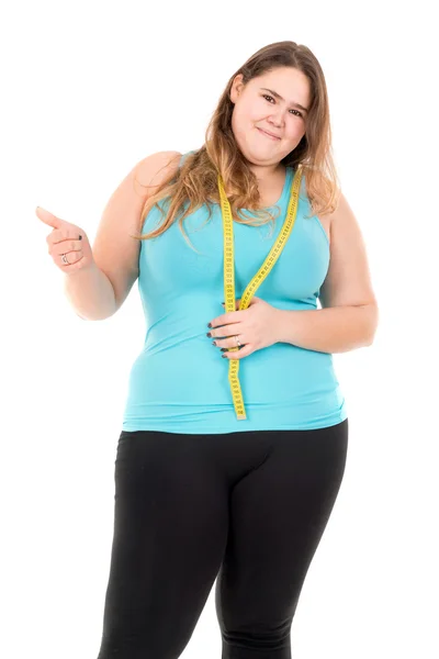 Large girl disgusted with measuring tape — Stock Photo, Image