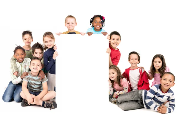 Group of children with blank board — Stock Photo, Image