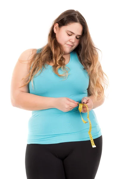 Fat girl measuring waist — Stock Photo, Image