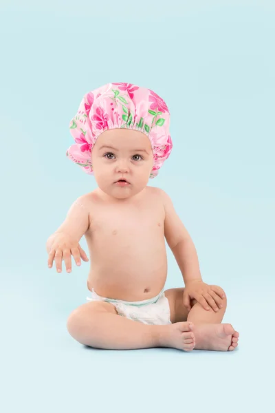 Baby girl in shower cap — Stock Photo, Image