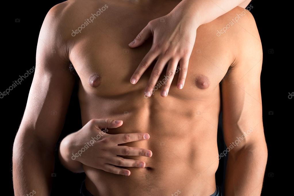 Woman hands touching man's body Stock Photo by ©luislouro 82476856