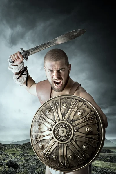 Gladiator warrior with weapon — Stock Photo, Image