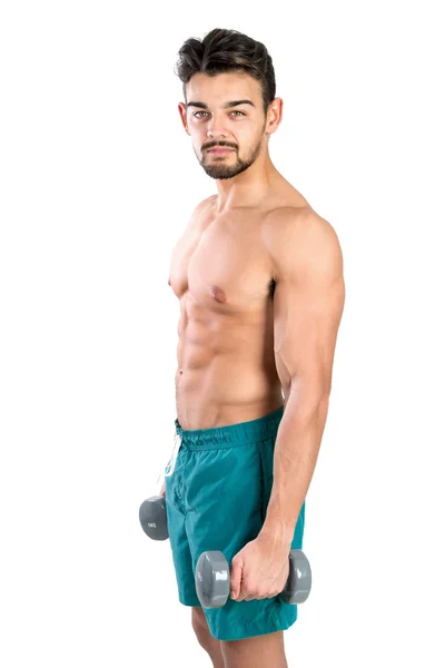 Young man exercising with dumbbells — Stock Photo, Image