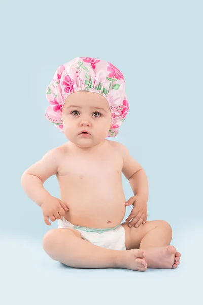 Baby girl in shower cap — Stock Photo, Image