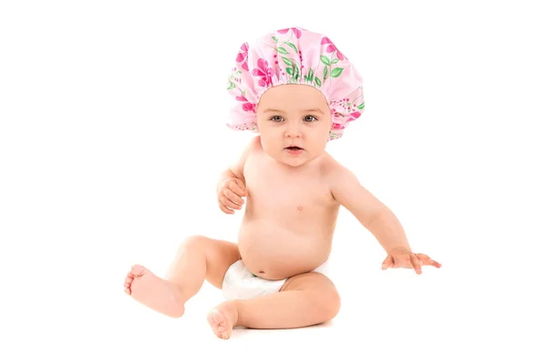 Baby girl in shower cap — Stock Photo, Image