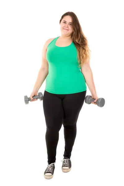 Large girl exercising with dumbbells — Stock Photo, Image