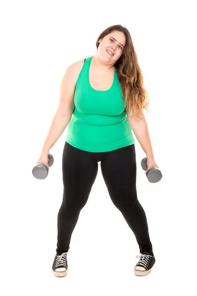 Large girl exercising with dumbbells — Stock Photo, Image