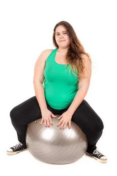 Chica grande con bola de ejercicio — Foto de Stock