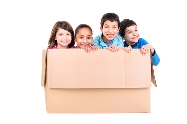 Happy kids in a box — Stock Photo, Image