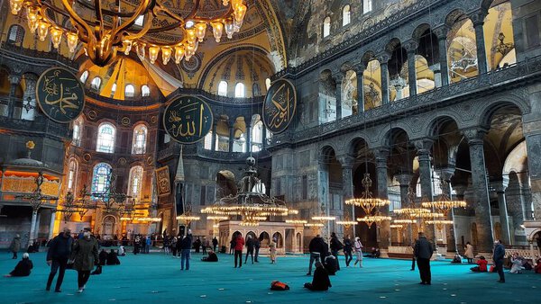 Istanbul, Turkey - December 2020: Interior of the Hagia Sophia Mosque (Sophia Istanbul). Islamic parishioners and tourists visit a mosque during the Covid-19 coronavirus pandemic.