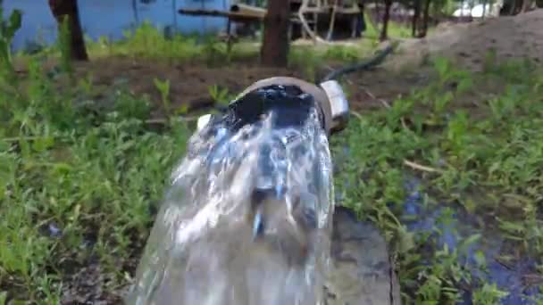 Europe, Kiev region, Ukraine - June 2021: Drinking water flows from a new well. An engineer drills a well for water. Drilling rig worker during work. The process of drilling a well for drinking water. — Stock Video