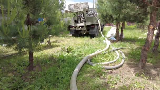Europe, Kiev region, Ukraine - June 2021: An engineer is drilling a water well. Drilling rig worker during work. The process of drilling a well for water. Drilling rig. — Stock Video