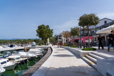 KRK Island, Njivice, Croatia - April 21, 2025: Cityscape. View of the city embankment and Easter eggs. Easter celebrations in the city.