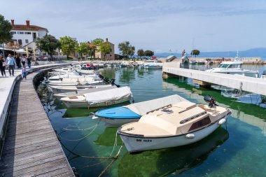 KRK Island, Njivice, Croatia - April 21, 2025: Cityscape. Yachts in the marina. Panorama of the city center.
