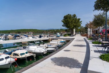 KRK Island, Njivice, Croatia - April 21, 2025: Cityscape. Yachts in the marina. Panorama of the city center.