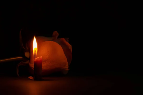 Candle Flame Next One Rose Dark Close — Stock Photo, Image