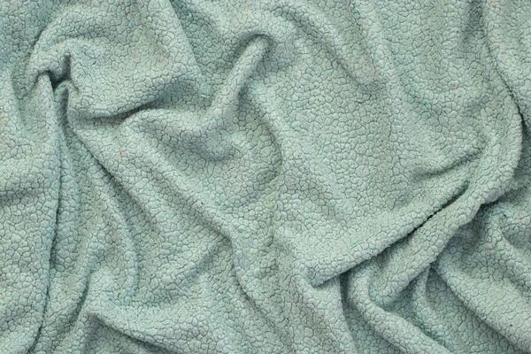 Arkaplan olarak düz açık mavi kırışık kumaş, kumaş dokusu